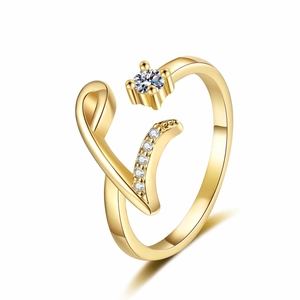 Detail of adjustable gold musical note ring featuring sparkling zircon pavé and accents