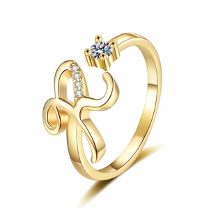 Detailed view of an adjustable gold-plated ring featuring a zircon-studded letter R design