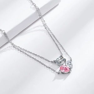 Double-layer silver necklace with rectangular and pink teardrop zircon pendants on white background