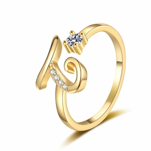 Detail of gold letter K open ring with sparkling round stones and micro-pave crystals