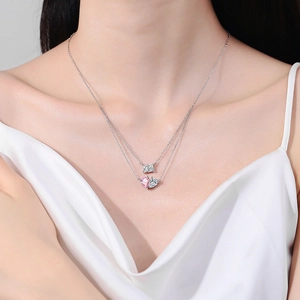 Elegant double-layered silver necklace featuring pink heart gemstone and zircon pendant