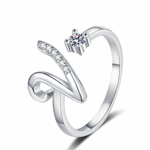 Detailed view of silver adjustable ring featuring crystal pave letter and prong-set stone