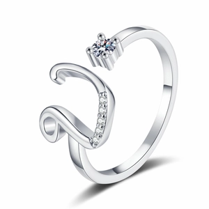 Macro detail of silver adjustable ring featuring a large round diamond and micro-pave accents