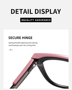 Detail view of the secure spring hinge on pink and black cat eye glasses frames