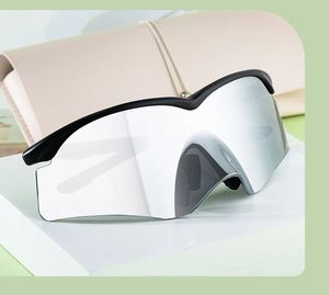 Detail of sleek half-frame cycling sunglasses with silver mirrored lens and matte black frame