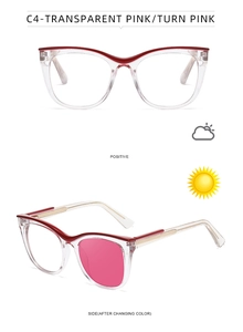 Macro view of cat-eye glasses showing photochromic transition from clear to pink lens
