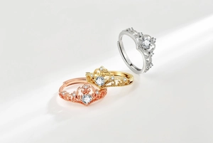 Detail of three crown rings in gold, silver and rose gold with S925 engraved stamp