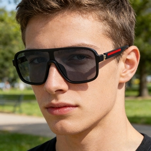 Detail view of square sunglasses with iconic red stripe on the temple for men