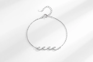Detail of S925 sterling silver wavy bracelet featuring tiny sparkling zircon stones