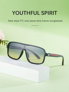 Detail of square oversized gradient sunglasses with red accents on the temples