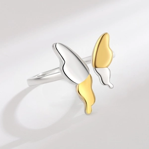Minimalist butterfly open ring with two-tone finish shown from a 45-degree angle