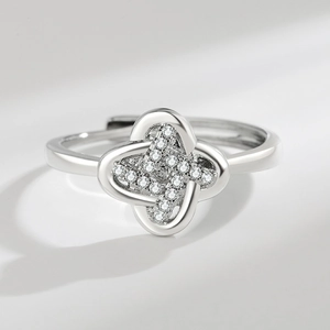 Polished silver four-leaf clover adjustable ring with sparkling cubic zirconia stones