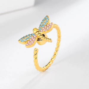 Adjustable gold dragonfly spinner ring with colorful zircon stones on twisted band