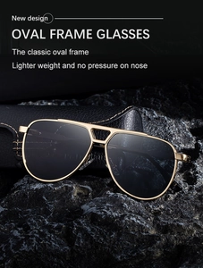 Detailed shot of pilot sunglasses with gold metal frame on a black rock background