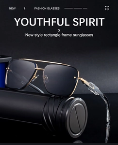 Detail of square frame sunglasses showing golden metal temples and hollowed-out side design