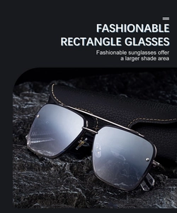 Macro detail of rectangular double-bridge sunglasses with silver lenses on a dark stone base