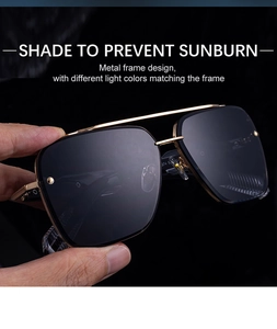 Close-up of golden metal frame aviator sunglasses with dual bridge and dark lenses