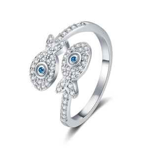 Adjustable silver fish ring featuring sparkling cubic zirconia and blue gemstone accents