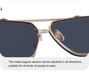 Macro shot of adjustable clear nose pads on gold metal frames of square sunglasses