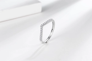 Detailed view of silver V-shaped wishbone ring with sparkling micro-pave crystals