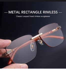 Detail of rimless rectangle sunglasses with gold leopard head decor and wood grain temples