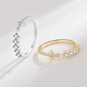 Elegant gold and silver cross rings with micro-pave zircons and open adjustable design