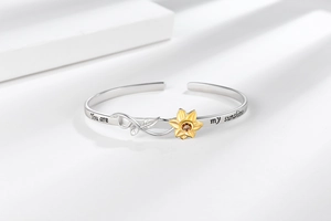 Detail of sunflower ring with You Are My Sunshine engraving and crystal inlay