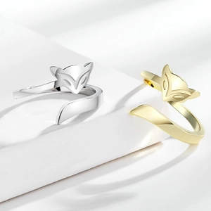 Elegant fox open ring in gold and silver finish on a minimalist white display