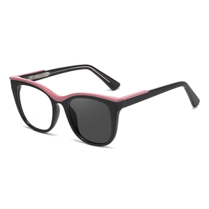 Chic cat-eye photochromic glasses with black and pink frames and dual-tone lenses