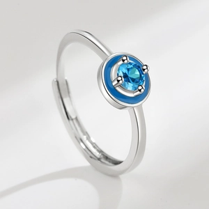 Adjustable silver ring featuring a blue round-cut moissanite and dark blue enamel detail