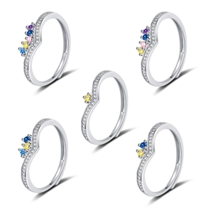Detailed view of stackable heart wave rings with colorful zircons and silver finish