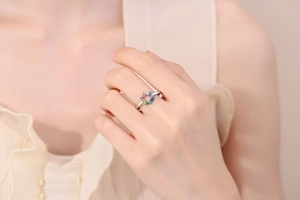 Macro view of adjustable silver hexagon ring with colorful baguette-cut cubic zirconia