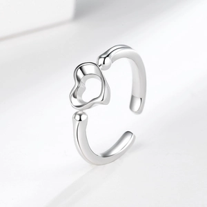 Minimalist silver open heart ring with hollow geometric design and polished finish