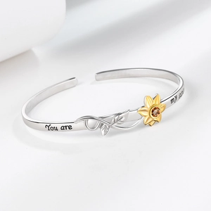 Silver cuff bracelet with sunflower design and You are my sunshine engraving