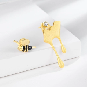 Fashionable golden bee and honey droplet mismatched earrings set with sparkling zircon stone
