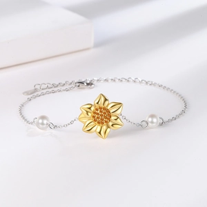 Silver sunflower pearl bracelet with gold petals and orange zircon crystals