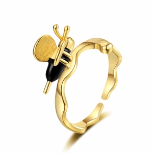 Elegant gold bee open ring with black enamel details and textured wings on white background