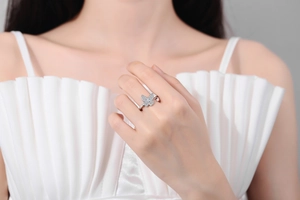 Close-up of elegant silver butterfly ring with pavé zircons worn by a female model