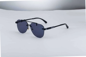 Detailed side view of rimless aviator sunglasses with purple lenses and textured arms