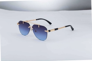 Detail of gold metal temples with mesh texture on frameless gradient pilot sunglasses