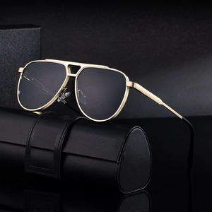 Classic gold aviator sunglasses with dark lenses and luxury leather case for men