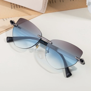 Lunettes de soleil œil-de-chat sans monture avec verres dégradés bleu-violet et métal