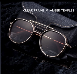 Close-up of retro aviator sunglasses with dual-bridge and leather stitch detail
