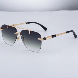 Fashion rimless pilot sunglasses with gradient grey lenses and golden metal frame detail