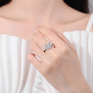 Elegant butterfly ring with white cubic zirconia stones on model finger