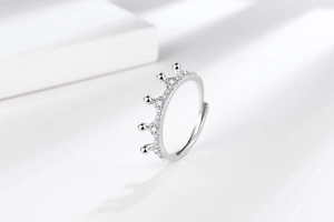Macro detail of silver magic crown ring with zircon pavé and adjustable band