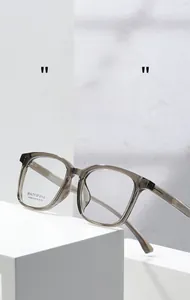 Detail view of transparent grey square optical glasses AT68603 on minimalist display