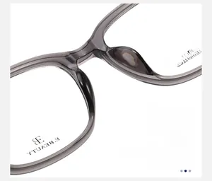 Detailed close-up of integrated nose pads on grey translucent square glasses frames