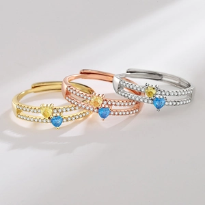 Double-layered heart ring set with yellow and blue gemstones in gold and silver finishes