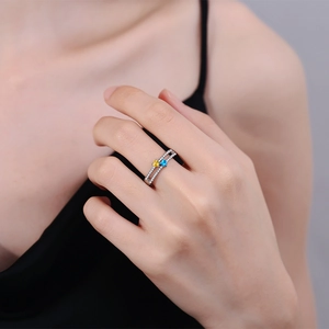 Double-layered silver ring with yellow and blue heart-shaped stones and micro-pave crystals